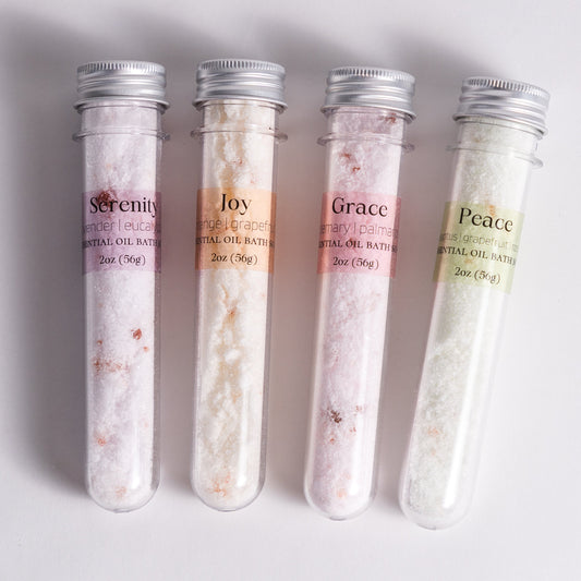 Handmade essential oil bath soak gift set from Megan’s Pantry includes four 2 oz tubes in signature scents: Serenity, Joy, Grace, and Peace. Made with natural salts and organic essential oils, beautifully packaged in a kraft gift box with pine shred and ribbon. Perfect spa-inspired gift for birthdays, showers, or relaxing self-care rituals