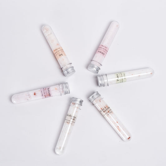 Single 2oz bath salt tube from Megan’s Pantry, handmade with natural salts and organic essential oils. Choose from six blends including Serenity, Joy, Grace, Peace, Eucalyptus Only, and Relax & Rejuvenate. Packaged in a clear plastic tube, perfect for gifting, stocking stuffers, or adding to a self-care spa set. Leaves skin soft and provides a calming bath experience.