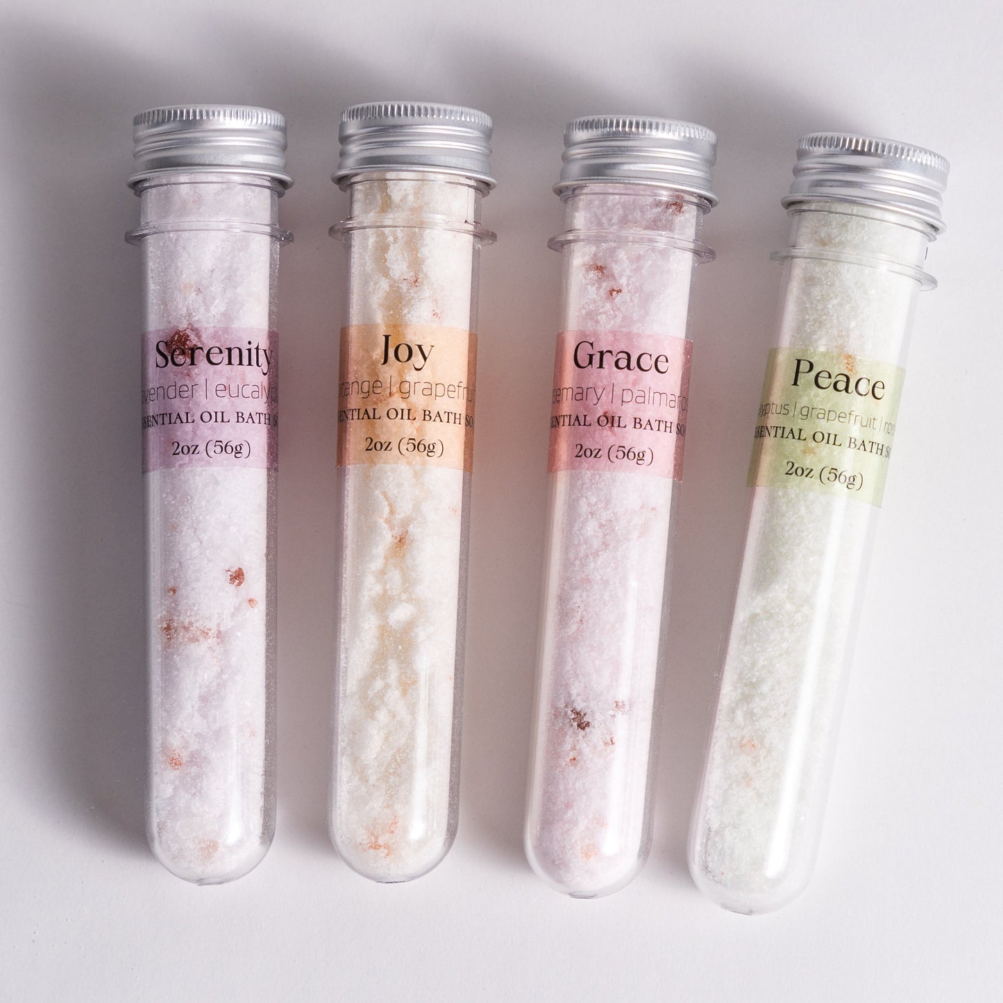 Single 2oz bath salt tube from Megan’s Pantry, handmade with natural salts and organic essential oils. Choose from six blends including Serenity, Joy, Grace, Peace, Eucalyptus Only, and Relax & Rejuvenate. Packaged in a clear plastic tube, perfect for gifting, stocking stuffers, or adding to a self-care spa set. Leaves skin soft and provides a calming bath experience.