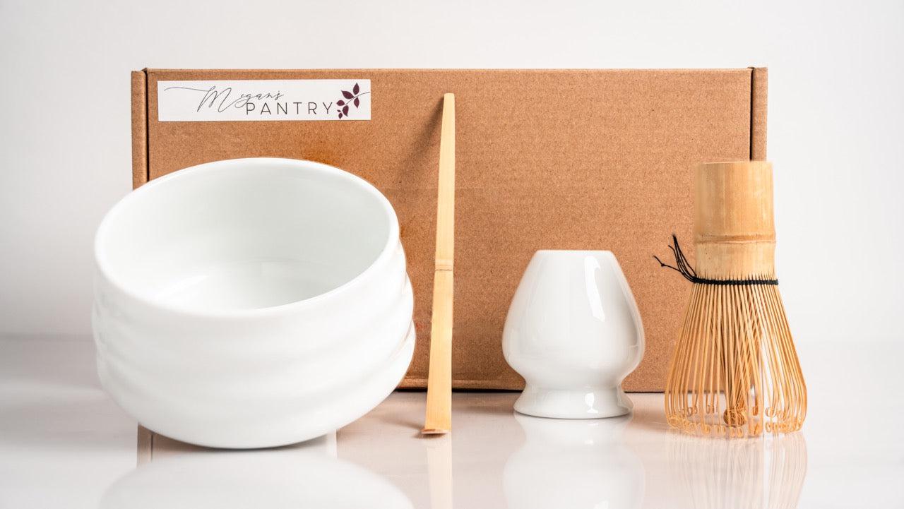 Matcha accessory set with blending bowl, bamboo whisk, measuring scoop, and whisk holder