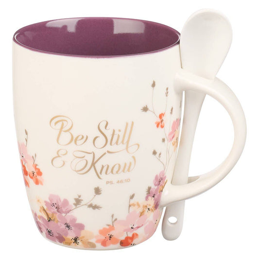 White ceramic mug with rose and lilac watercolor florals, deep plum interior, matching white spoon in handle