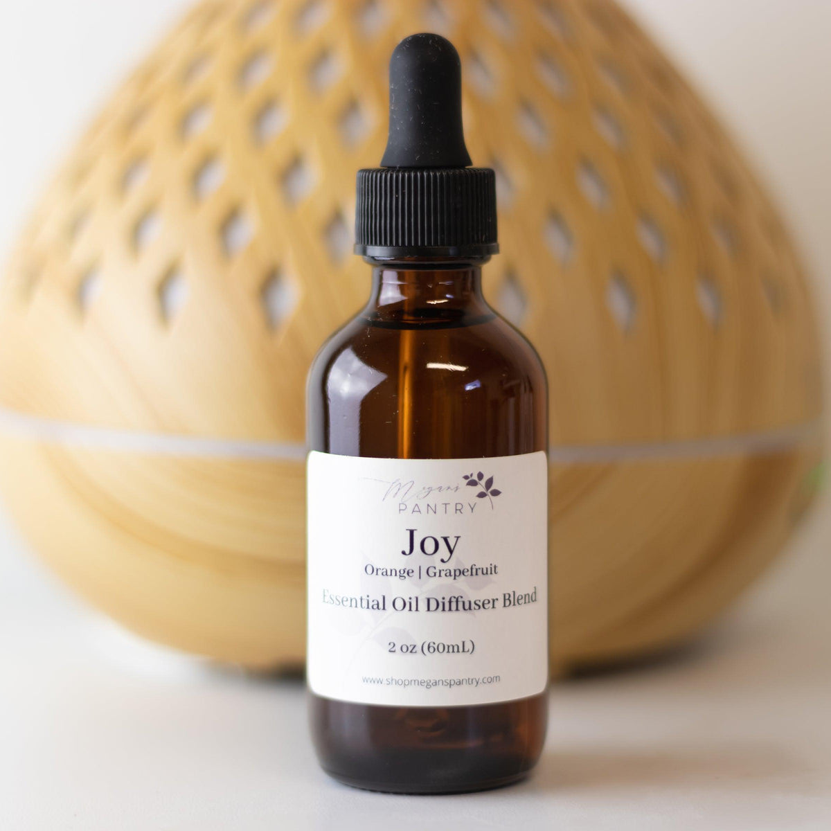 Megan's Pantry 2 oz signature essential oil diffuser blend bottles with lavender, eucalyptus, citrus, rosemary, and palmarosa options