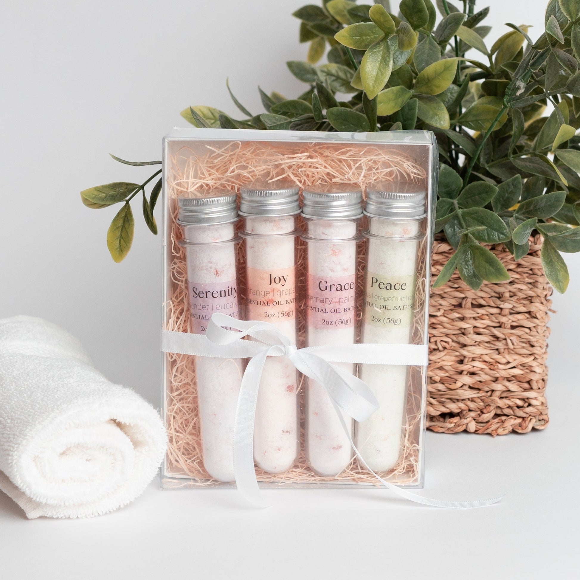 Handmade essential oil bath soak gift set from Megan’s Pantry includes four 2 oz tubes in signature scents: Serenity, Joy, Grace, and Peace. Made with natural salts and organic essential oils, beautifully packaged in a kraft gift box with pine shred and ribbon. Perfect spa-inspired gift for birthdays, showers, or relaxing self-care rituals