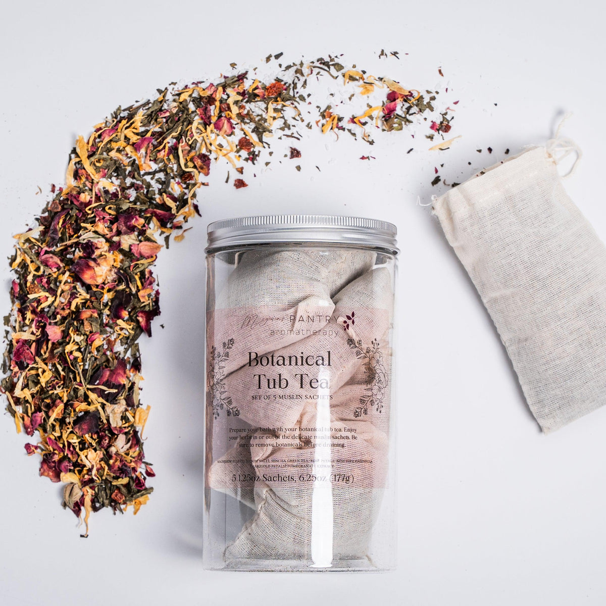 Megan's Pantry Botanical Tub Tea with muslin sachets of green tea, rose, hibiscus, and marigold for the bath.