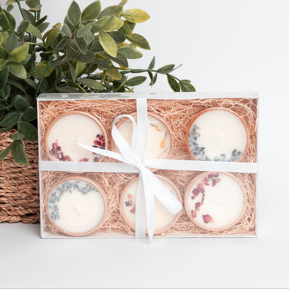 Gift set of six essential oil soy tealight candles in reusable wooden bowls, boxed with pine shred and ribbon