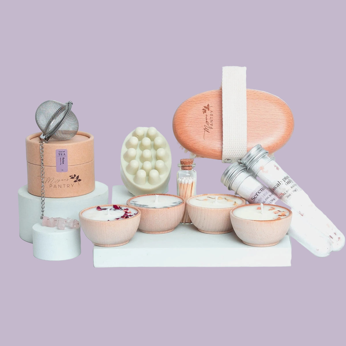 Perfect Spa Day gift set from Megan's Pantry with candles, bath soaks, body bar, body brush, herbal tea, and gemmed infuser