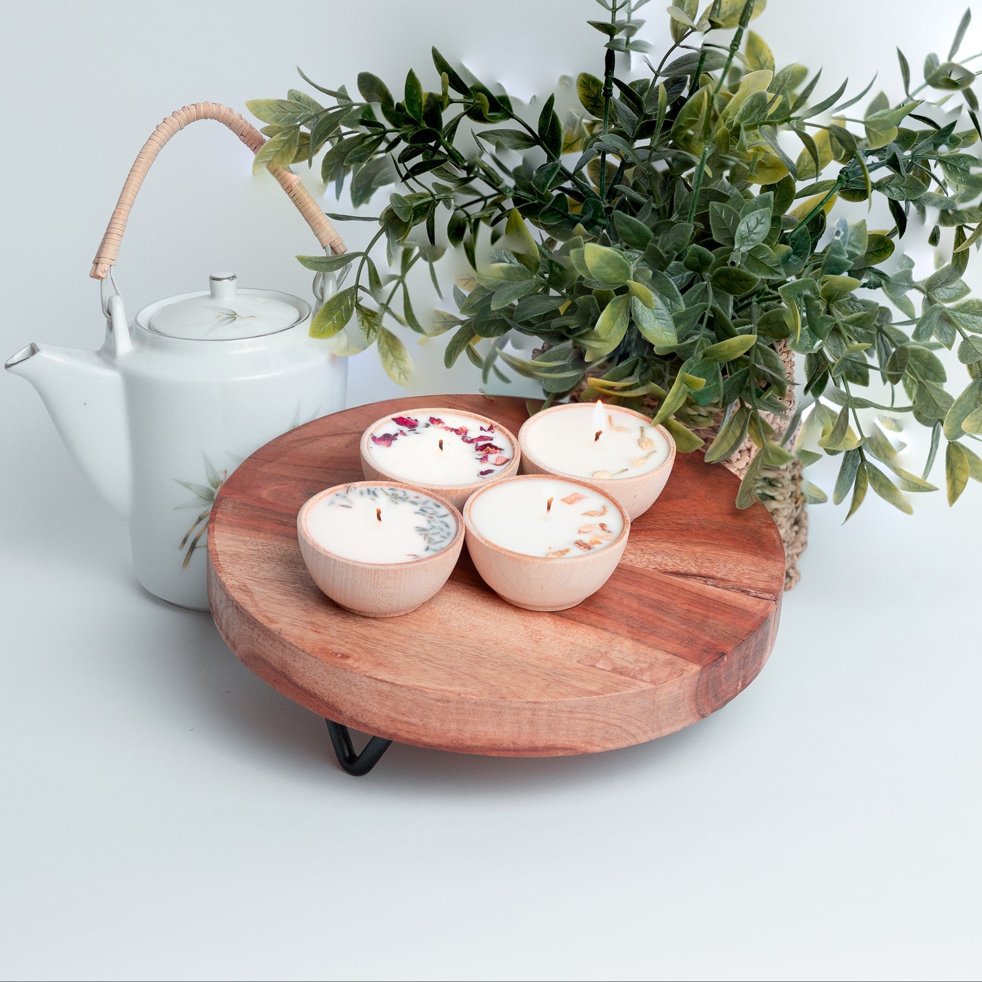 Gift set of six handmade soy tealight candles from Megan’s Pantry, each poured into a reusable wooden pinch bowl and scented with pure essential oils. Includes Serenity, Joy, Grace, and Peace blends topped with natural botanicals. Non-toxic, dye-free, beautifully packaged for gifting and perfect for relaxation, spa rituals, and aromatherapy.