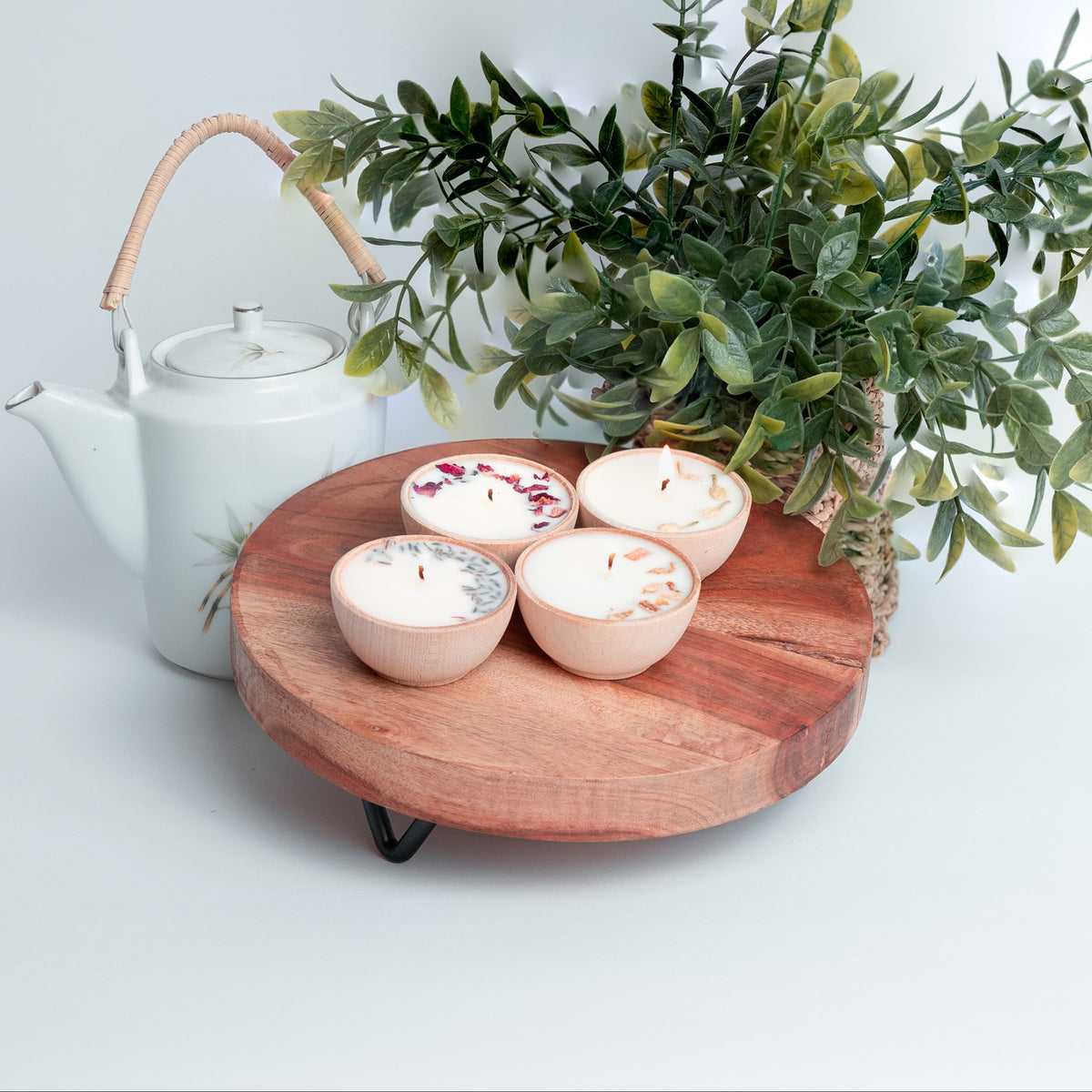 Gift set of six essential oil soy tealight candles in reusable wooden bowls, boxed with pine shred and ribbon