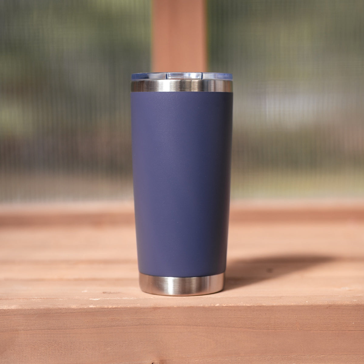 Insulated plum and brushed silver travel mug from Megan's Pantry with engraved Be still and know script.