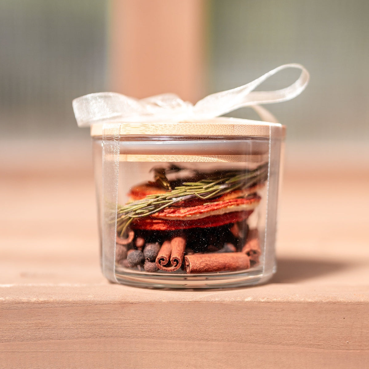 Ribbon-tied gift tag on the Golden Hour simmer pot jar with printed simmering instructions