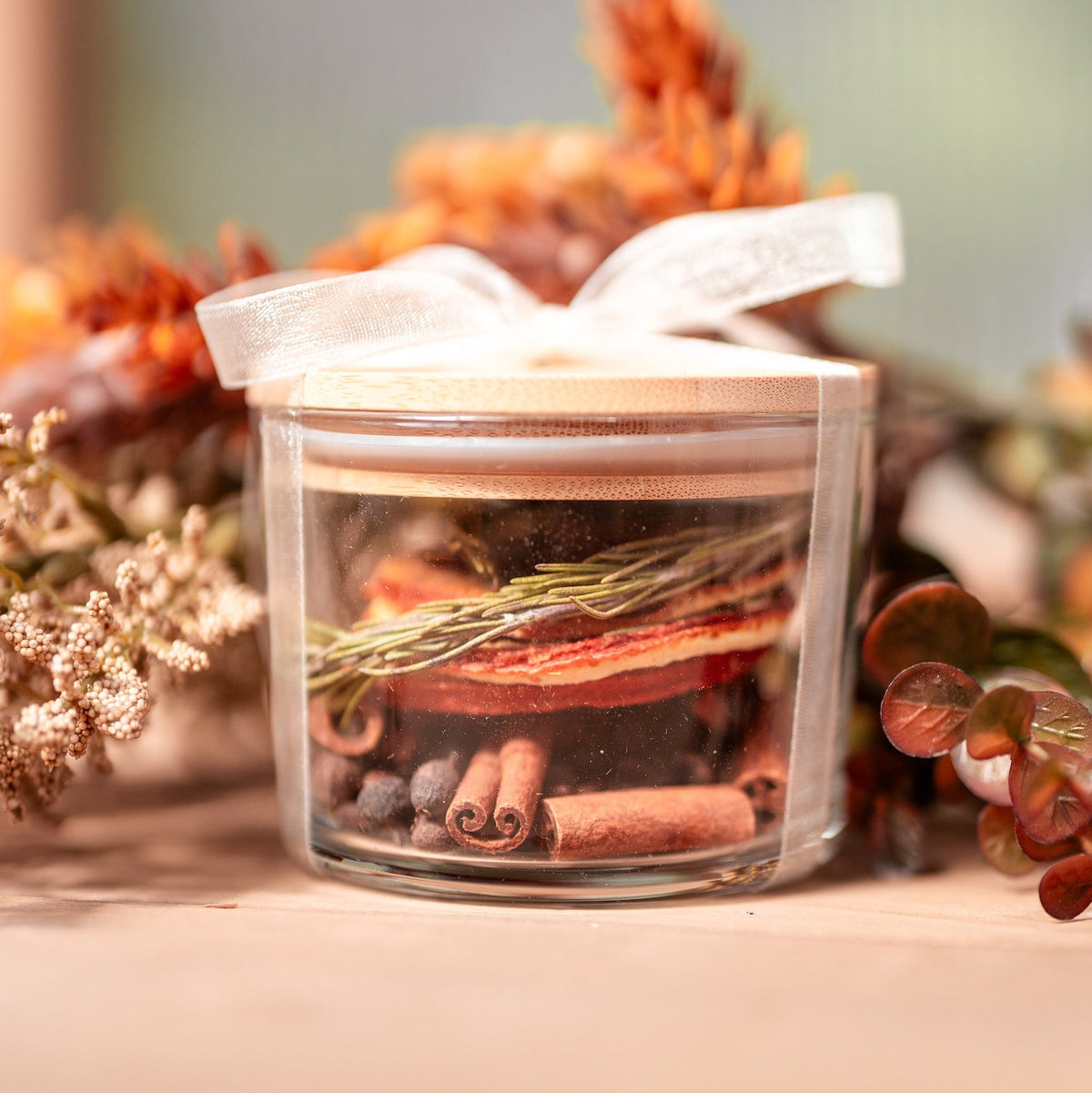 Golden Hour simmer pot in a glass jar with a pine lid, tied with ribbon and a gift tag