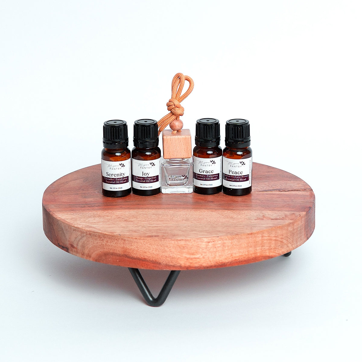 Drive and Diffuse set from Megan's Pantry with wood hanging car diffuser and signature essential oil blends