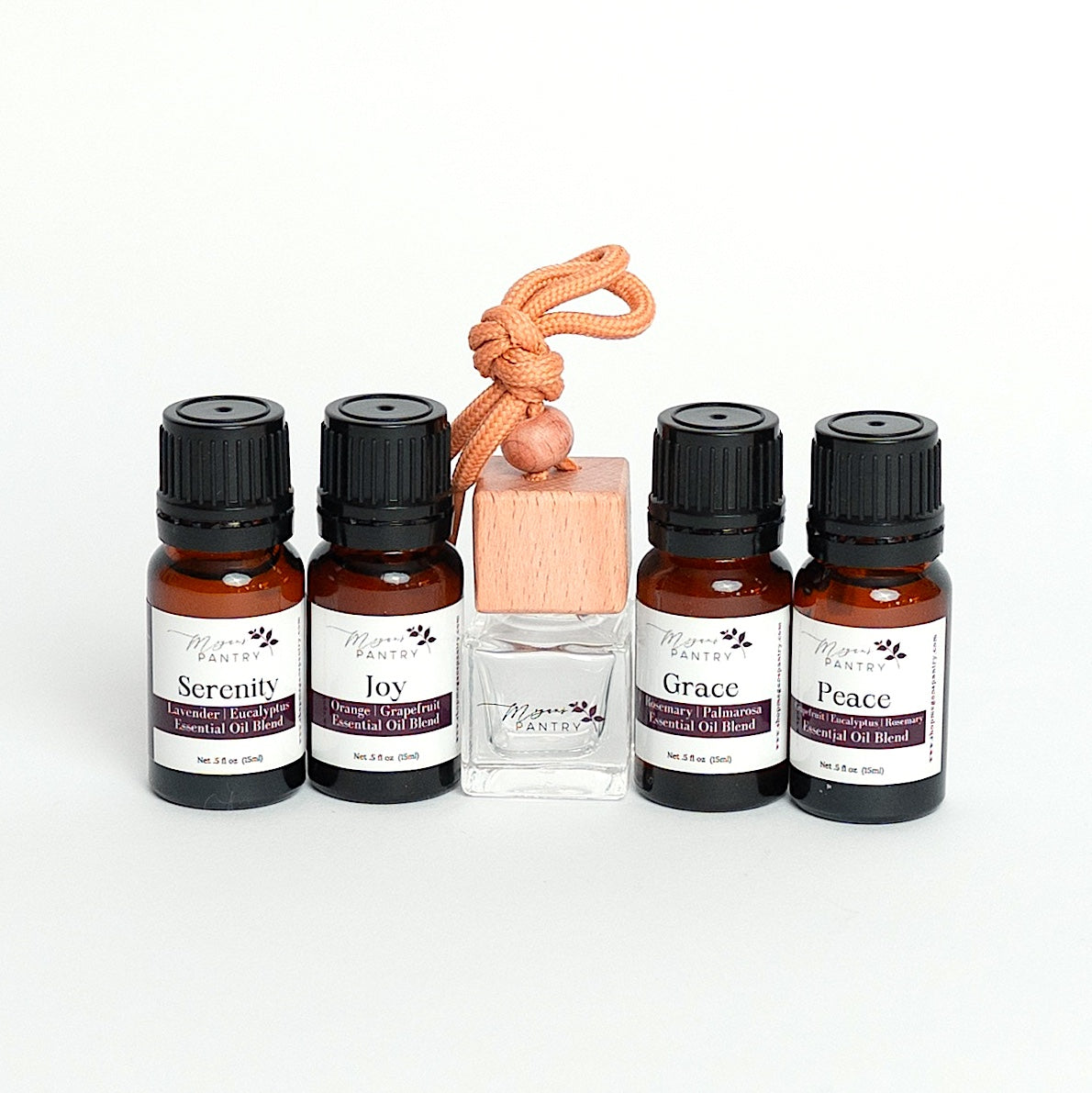 Drive and Diffuse set from Megan's Pantry with wood hanging car diffuser and signature essential oil blends