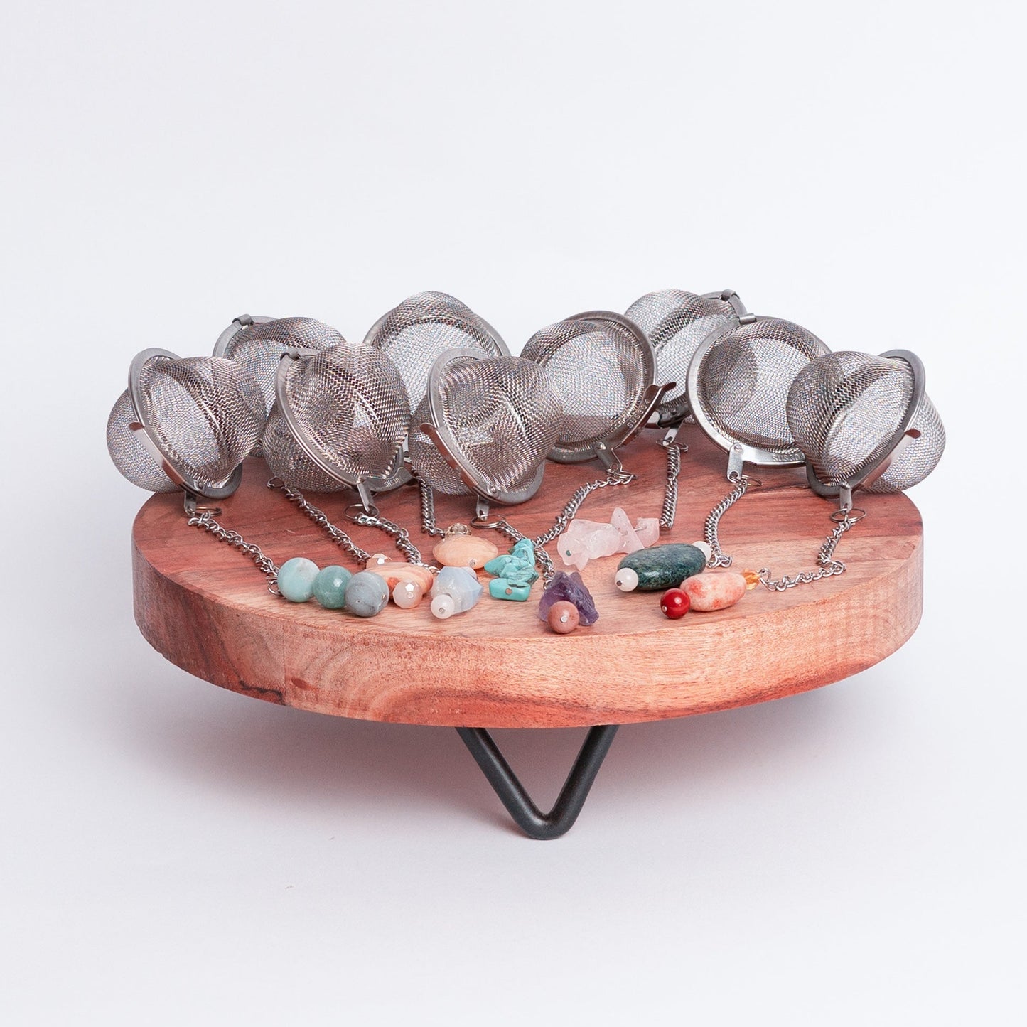 Handmade gemmed tea infuser ball from Megan’s Pantry featuring a large 2.5" stainless steel mesh for loose leaf tea. Each infuser includes a unique locally sourced gemstone charm. Crafted by Megan in Albuquerque NM this artisan tea accessory combines beauty and function and makes a perfect gift for tea lovers and wellness enthusiasts.