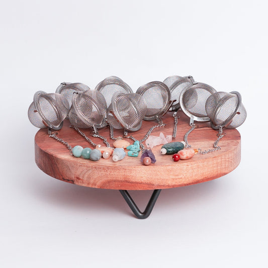 Handmade gemmed tea infuser ball from Megan’s Pantry featuring a large 2.5" stainless steel mesh for loose leaf tea. Each infuser includes a unique locally sourced gemstone charm. Crafted by Megan in Albuquerque NM this artisan tea accessory combines beauty and function and makes a perfect gift for tea lovers and wellness enthusiasts.