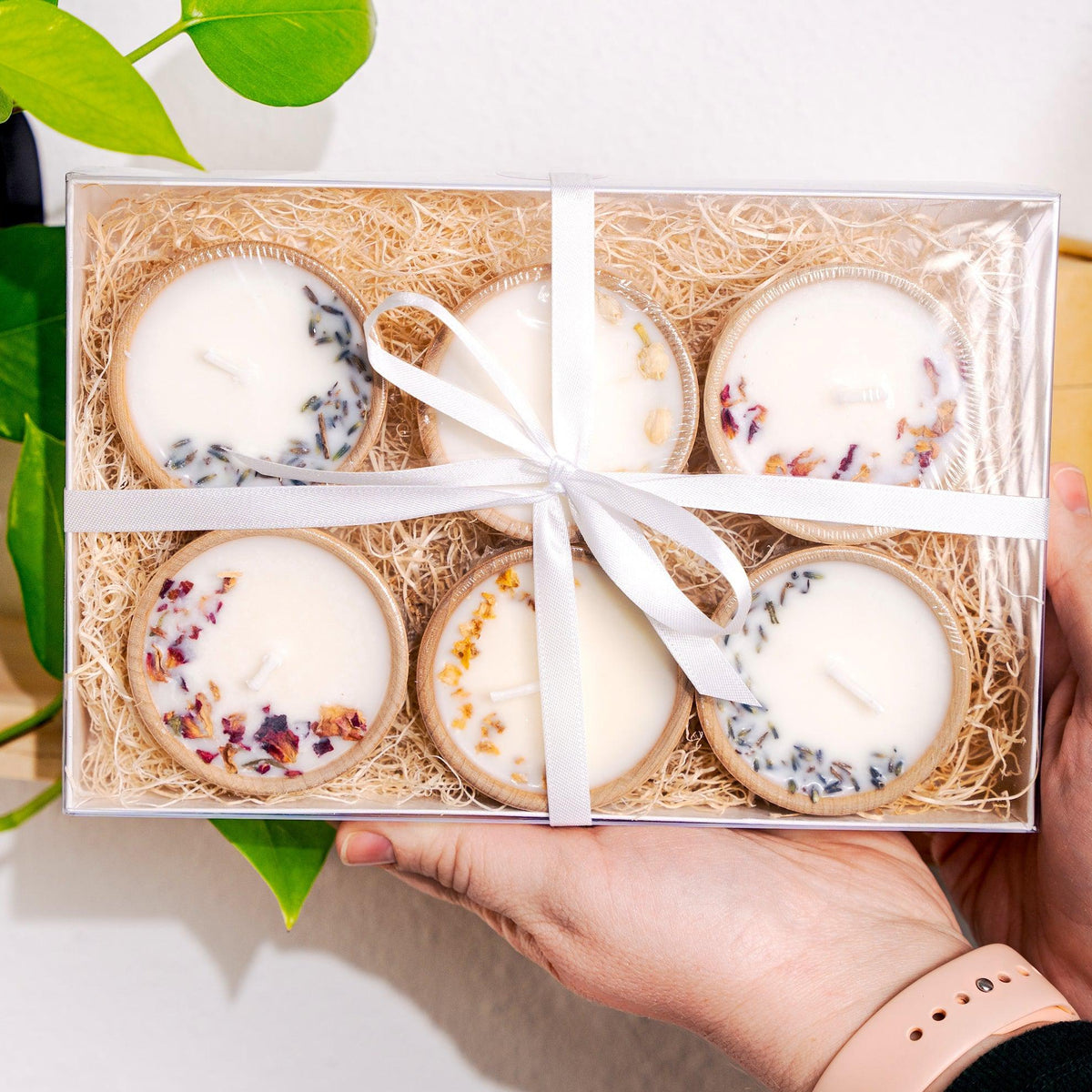 Gift set of six essential oil soy tealight candles in reusable wooden bowls, boxed with pine shred and ribbon