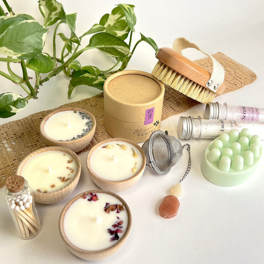 Megan’s Pantry Perfect Spa Day Gift Set featuring a 1 oz pouch of Relax herbal loose leaf tea, a gemmed stainless steel tea infuser, wooden aromatherapy tealight candles (set of 4), a box of matches, Serenity and Eucalyptus bath soaks (2 oz each), Peace triple butter body bar, and a natural bristle body brush — beautifully arranged for a luxurious spa day at home. Ideal wellness gift box for self-care, relaxation, stress relief, and thoughtful gifting.