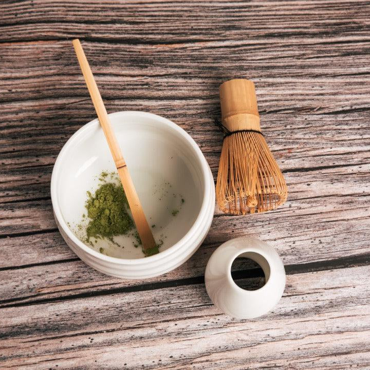 Matcha accessory set with blending bowl, bamboo whisk, measuring scoop, and whisk holder