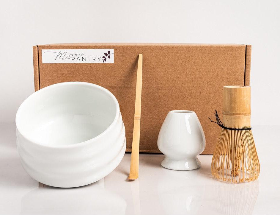 Matcha accessory set with blending bowl, bamboo whisk, measuring scoop, and whisk holder