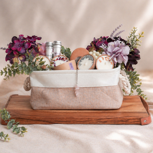 Decorative basket with candles and flowers on a wooden tray