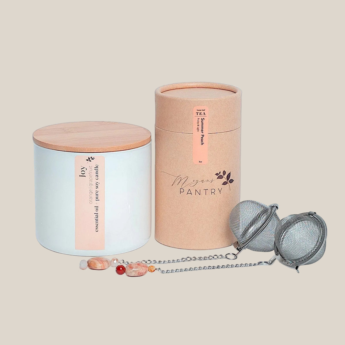 Tea for Two gift set from Megan's Pantry with Summer Peach tea, Joy candle, and two gemmed tea infusers