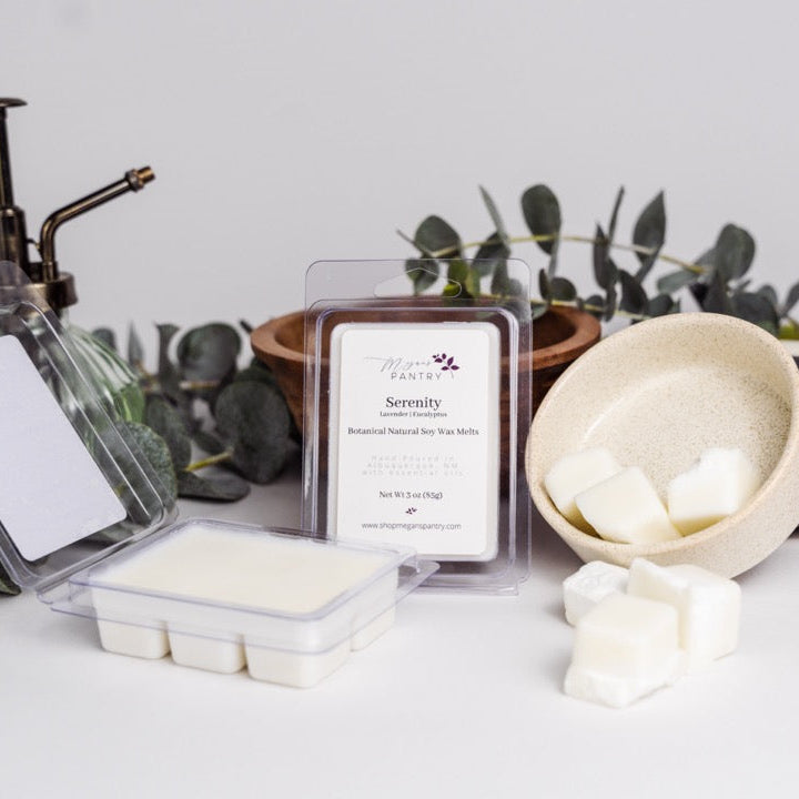 Hand-poured soy wax melts from Megan’s Pantry in recyclable containers, featuring six essential oil-infused fragrance options; clean, luxury aromatherapy for the home.