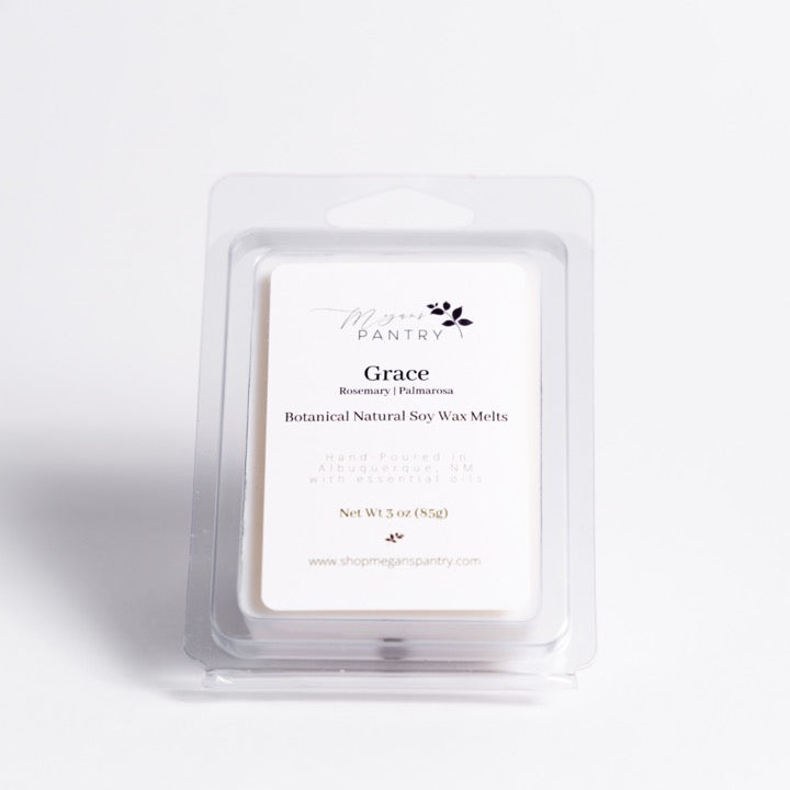 Hand-poured soy wax melts from Megan’s Pantry in recyclable containers, featuring six essential oil-infused fragrance options; clean, luxury aromatherapy for the home.