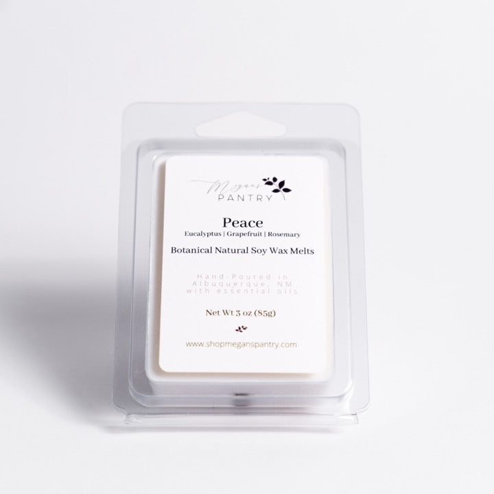 Hand-poured soy wax melts from Megan’s Pantry in recyclable containers, featuring six essential oil-infused fragrance options; clean, luxury aromatherapy for the home.