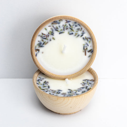 Set of two hand-poured soy tealight candles in reusable wooden bowls from Megan’s Pantry, infused with essential oils and botanicals for elegant, natural aromatherapy.