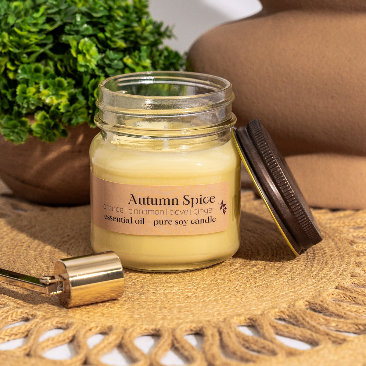 Autumn Spice 16 oz soy candle from Megan's Pantry in a glass jar with bamboo lid, scented with orange, cinnamon, and clove.