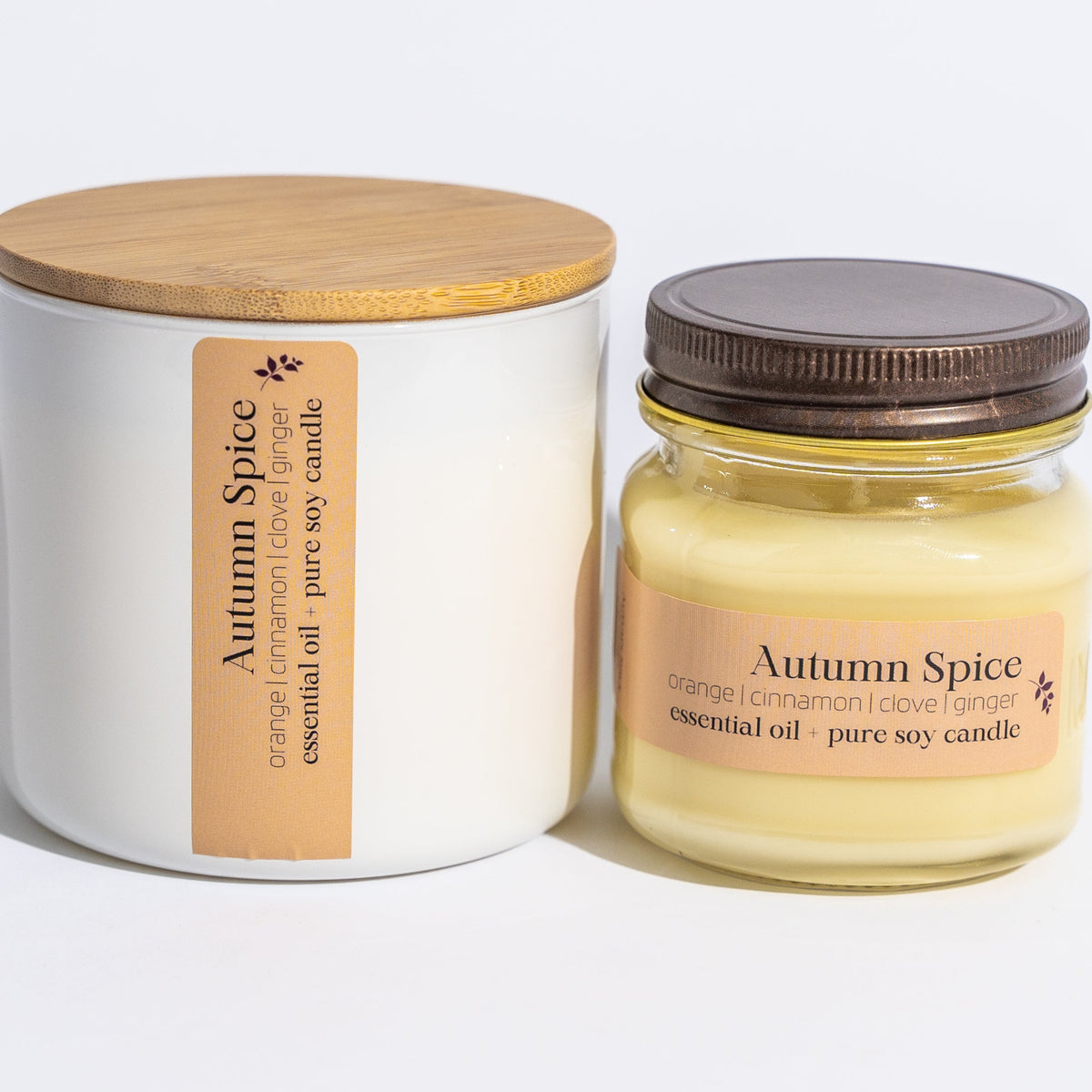 Autumn Spice 16 oz soy candle from Megan's Pantry in a glass jar with bamboo lid, scented with orange, cinnamon, and clove.