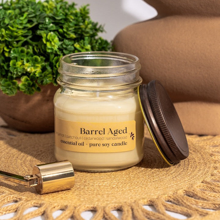Our decadent Aromatherapy Essential Oil Candles are hand-poured using the purest soy wax, pure cotton wicks, and our signature essential oil blend that is crafted in-house in small batches.
Barrel Aged is a blend of patchouli, bergamot, cedarwood, and sandalwood essential oils, creating a golden, musky aroma. Like enjoying an old scotch with a great friend in a mood-lit room.
