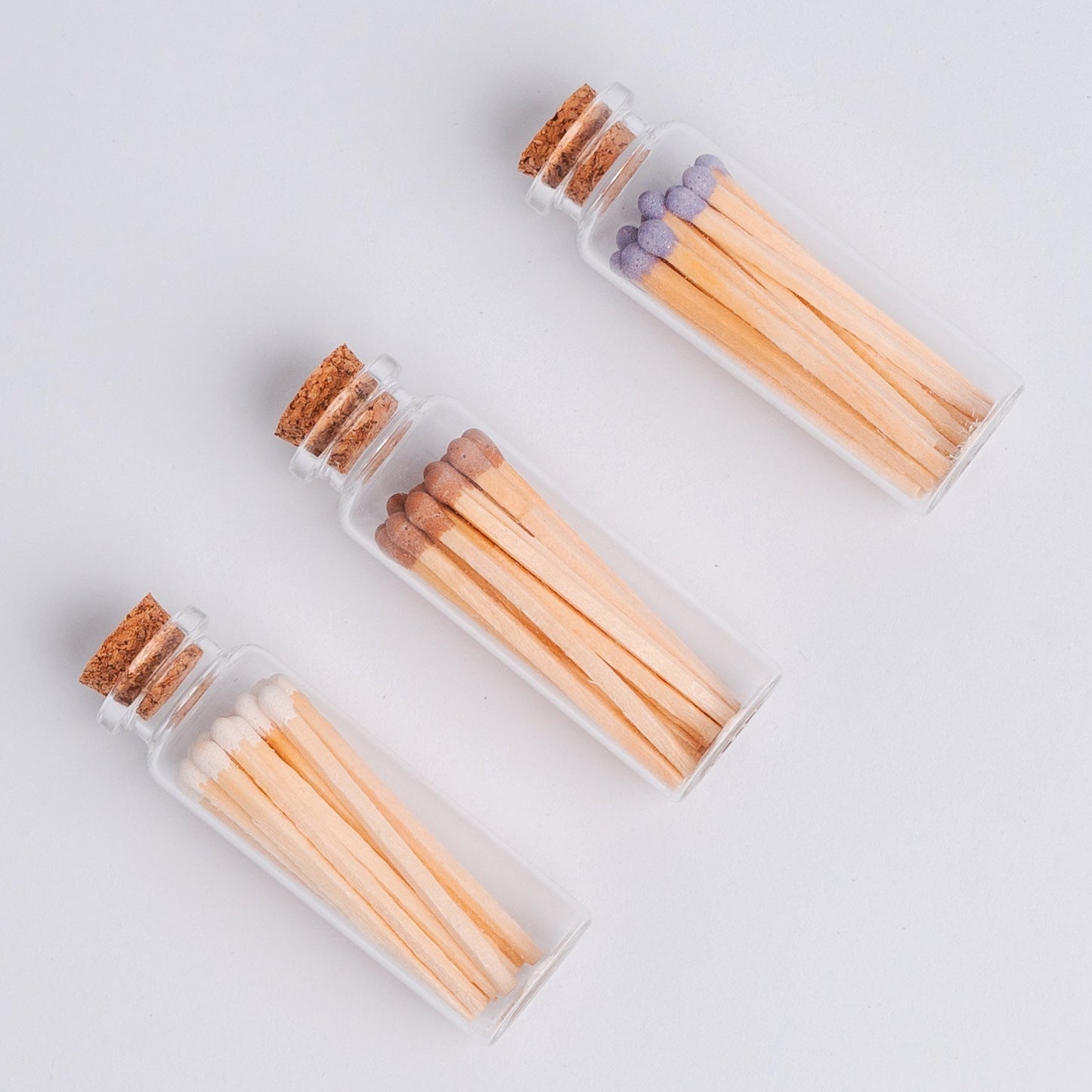These lovely match sets are the perfect addition to your favorite candle or candle gift.
Each glass vial contains 20 single-use colored wooden safety matches and a round piece of striker paper on the bottom. 100% free of Sulphur and toxic heavy metals.