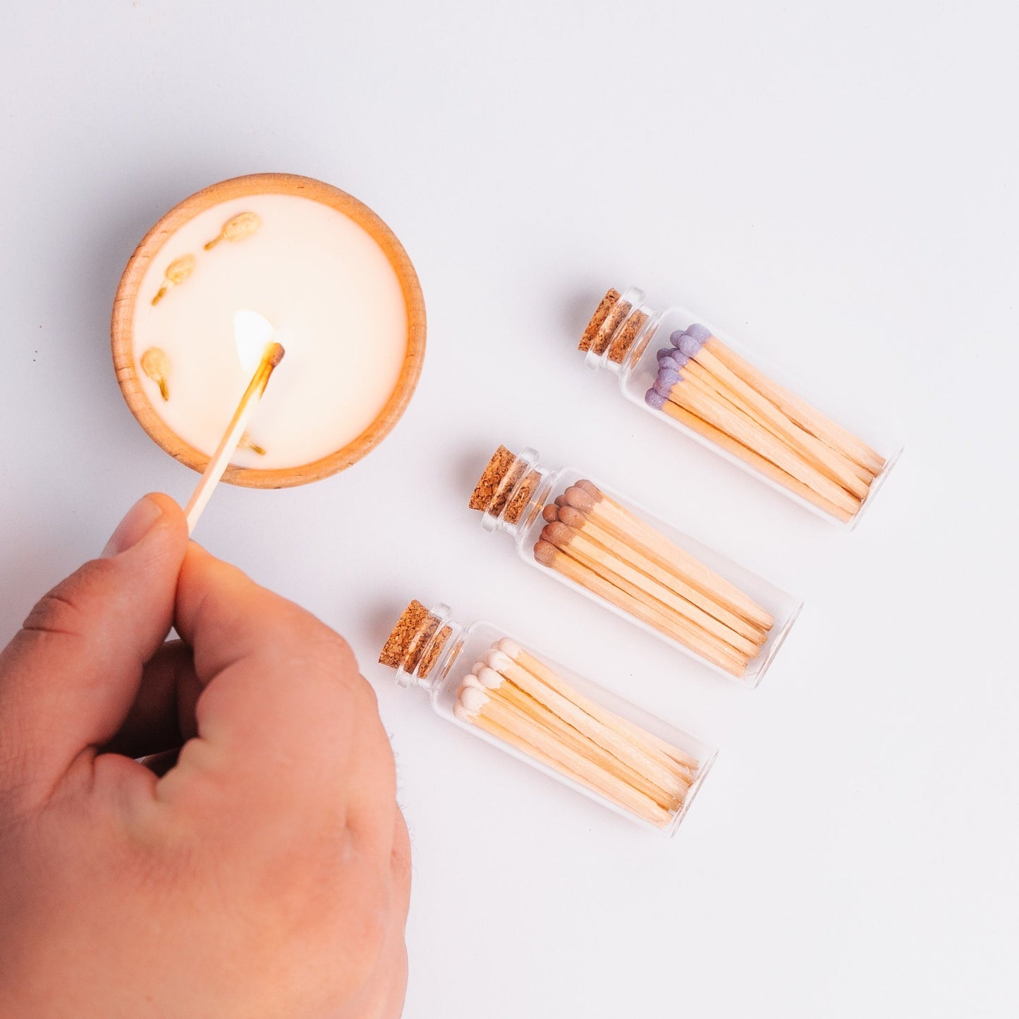 These lovely match sets are the perfect addition to your favorite candle or candle gift.
Each glass vial contains 20 single-use colored wooden safety matches and a round piece of striker paper on the bottom. 100% free of Sulphur and toxic heavy metals.